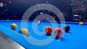 Billiard balls on a pool table in a pub  - concept of cue sports