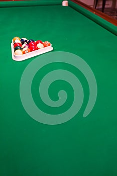 Billiard balls racked on pool table photo