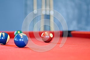 Billiard balls on a red pool table