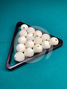 Billiard balls for russian billiard in a wooden triangle