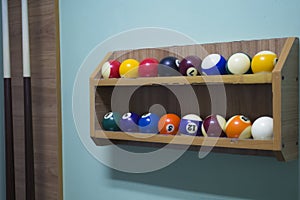 Billiard balls on the shelf