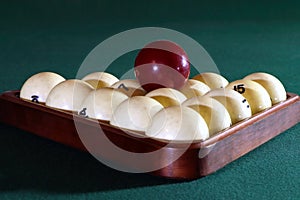 Billiard balls in the triangle on the billiard table. Russian billiard