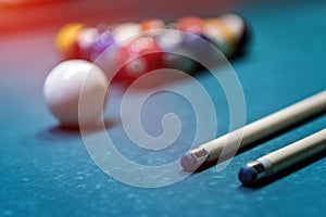 Billiard balls in triangle with cue on table