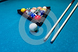 Billiard balls in triangle with cue on table