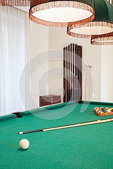 Billiard cue on billiard table