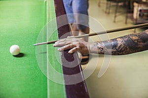 Billiard cue ready to hit white ball