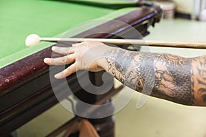 Billiard cue ready to hit white ball