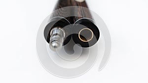 Billiard cues on a white background. Parts of a billiard cue close-up. Live photos of a billiard cue