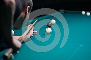 Billiard green table in hall with white balls