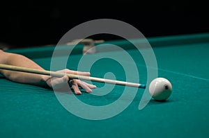 Billiard green table in hall with white balls