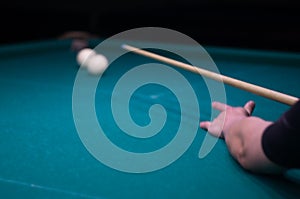 Billiard green table in hall with white balls