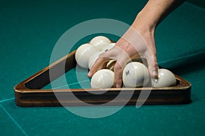 Billiard green table in hall with white balls