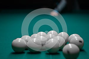 Billiard green table in hall with white balls