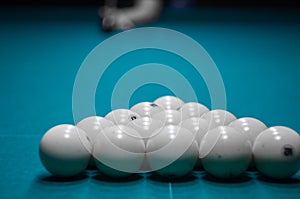 Billiard green table in hall with white balls