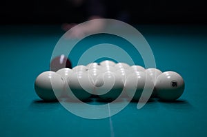 Billiard green table in hall with white balls