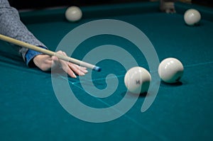 Billiard green table in hall with white balls