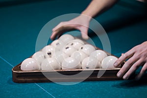 Billiard green table in hall with white balls