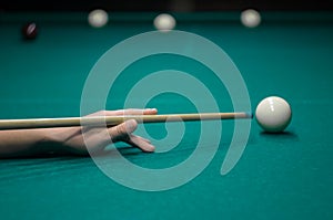 Billiard green table in hall with white balls