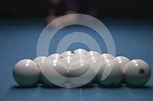 Billiard green table in hall with white balls