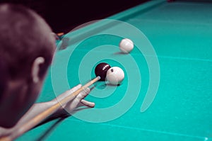 Billiard green table in hall with white balls