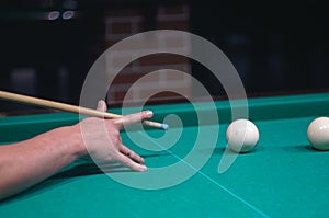 Billiard green table in hall with white balls