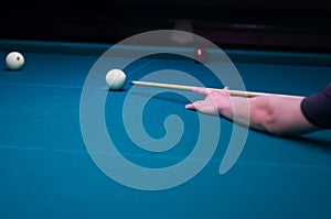 Billiard green table in hall with white balls