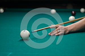 Billiard green table in hall with white balls