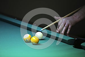 Billiard. hand with cue prepare hit a ball