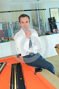 Billiard player looking at camera