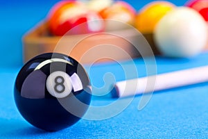 Billiard pool game eight ball with cue on billiard table