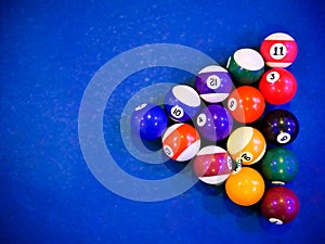 Billiard snooker pyramid balls on pool blue table