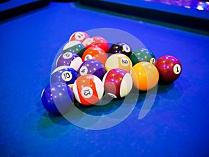 Billiard snooker pyramid balls on pool blue table