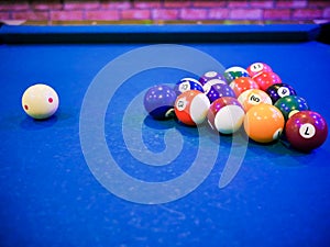 Billiard snooker pyramid balls on pool blue table