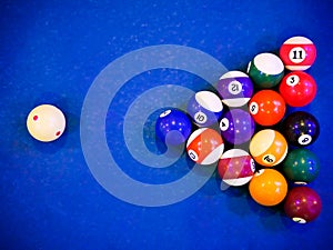 Billiard snooker pyramid balls on pool blue table