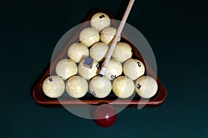 Billiard table with balls, cue, triangle. Green cloth. Playing billiard and pool. Ruusian billiard
