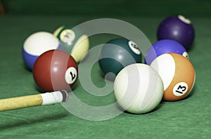 Billiard table balls, green background