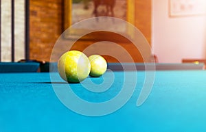 Billiard table close up. Playing billiard. Billiards balls and cue on green billiards table. Billiard sport concept. Pool billiard