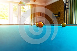 Billiard table close up. Playing billiard. Billiards balls and cue on green billiards table. Billiard sport concept. Pool billiard