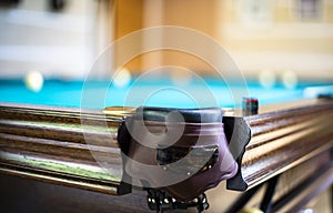 Billiard table close up. Playing billiard. Billiards balls and cue on green billiards table. Billiard sport concept. Pool billiard