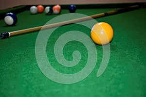 Billiard table with cue and balls. Green billiards background