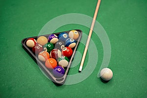 Billiard table with green surface and balls