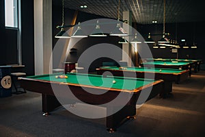 Billiard table with green surface and balls in the billiard club.Pool Game