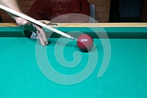 Billiard table and one billiard table with a cue