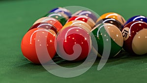 Billiard table setup featuring colorful pool balls, ready for an exciting game of cue sports