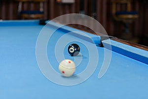 Billiard table with two balls ready for playing