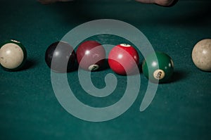 Billiards balls and cue on billiards table. Billiard sport concept