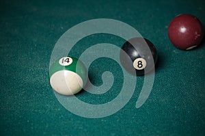 Billiards balls and cue on billiards table. Billiard sport concept