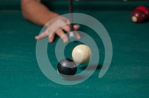 Billiards balls and cue on billiards table. Billiard sport concept