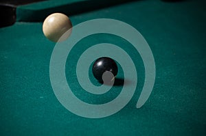 Billiards balls and cue on billiards table. Billiard sport concept