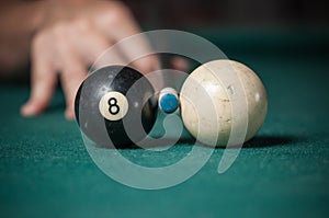 Billiards balls and cue on billiards table. Billiard sport concept